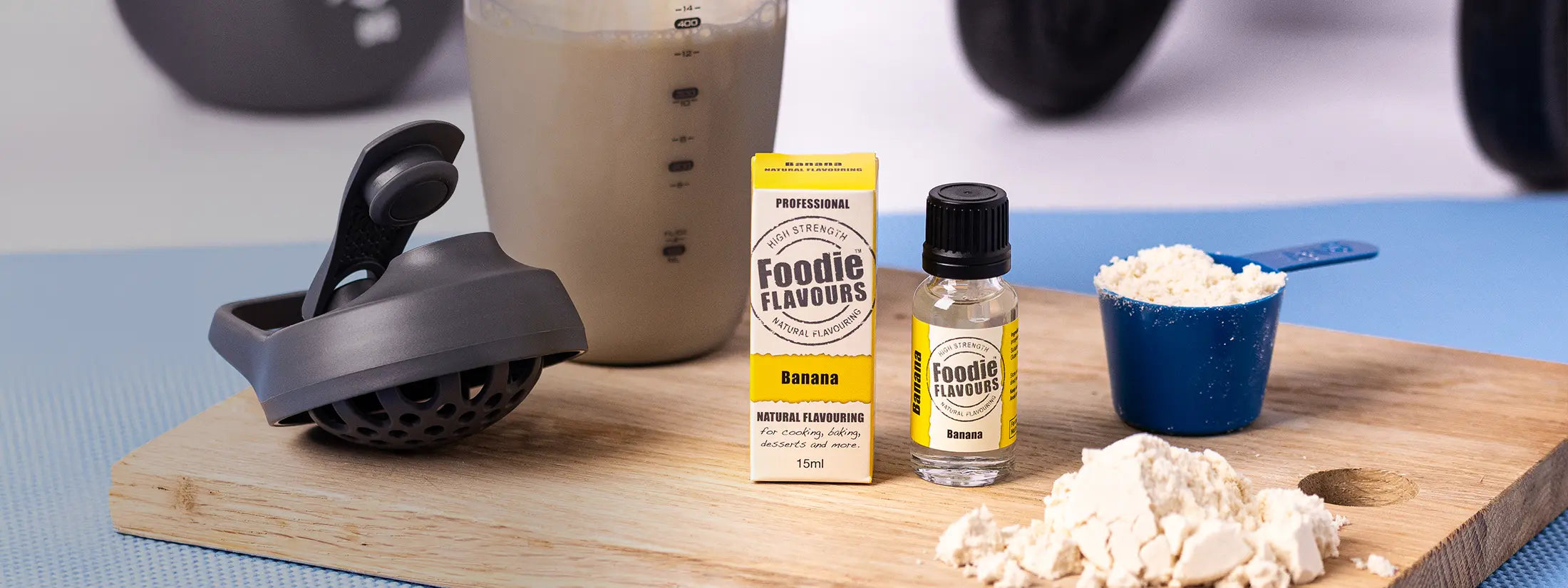glass bottle of foodie flavours' banana natural food flavouring, banana flavoured protein shake