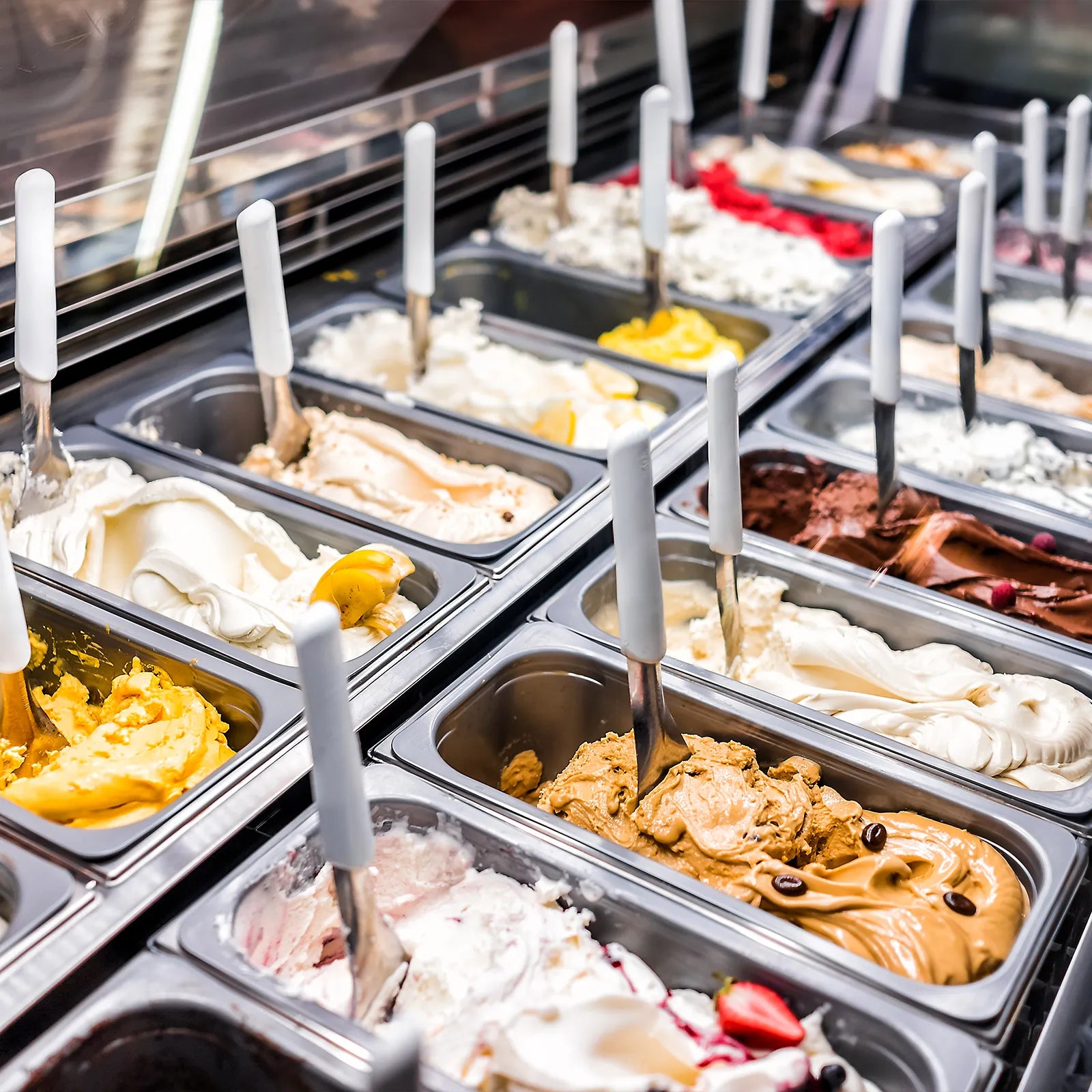 ice cream parlour with tubs of various flavoured iced cream
