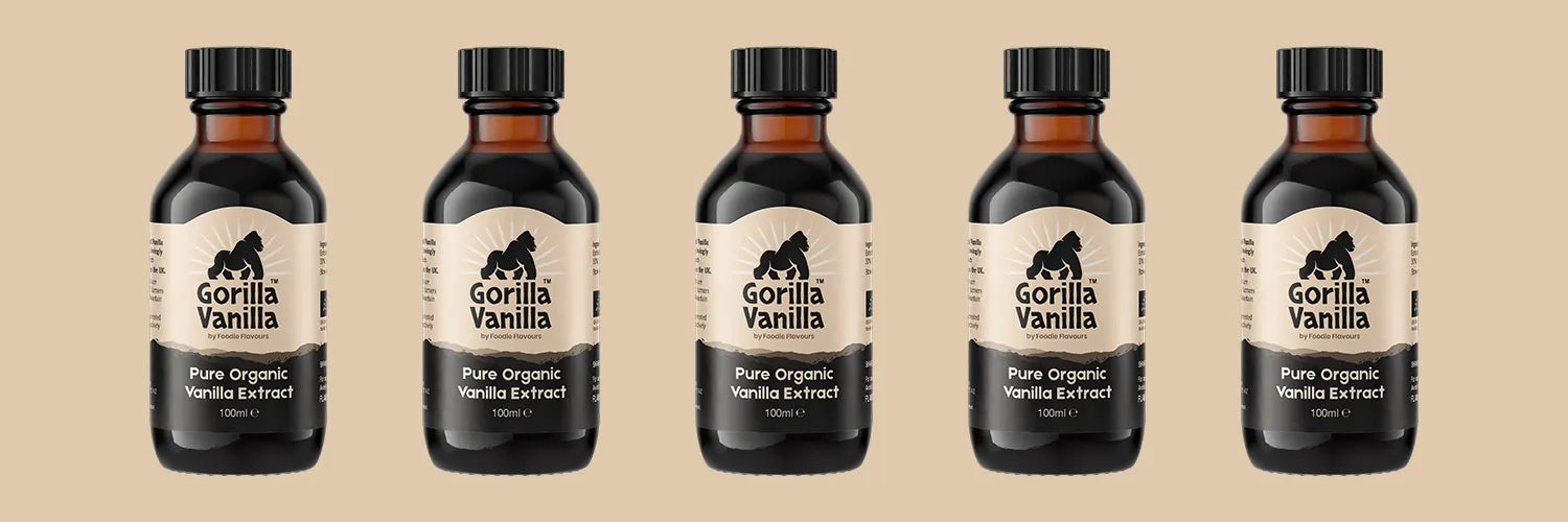 A line of glass bottles of gorilla vanilla, organic vanilla extract for baking.