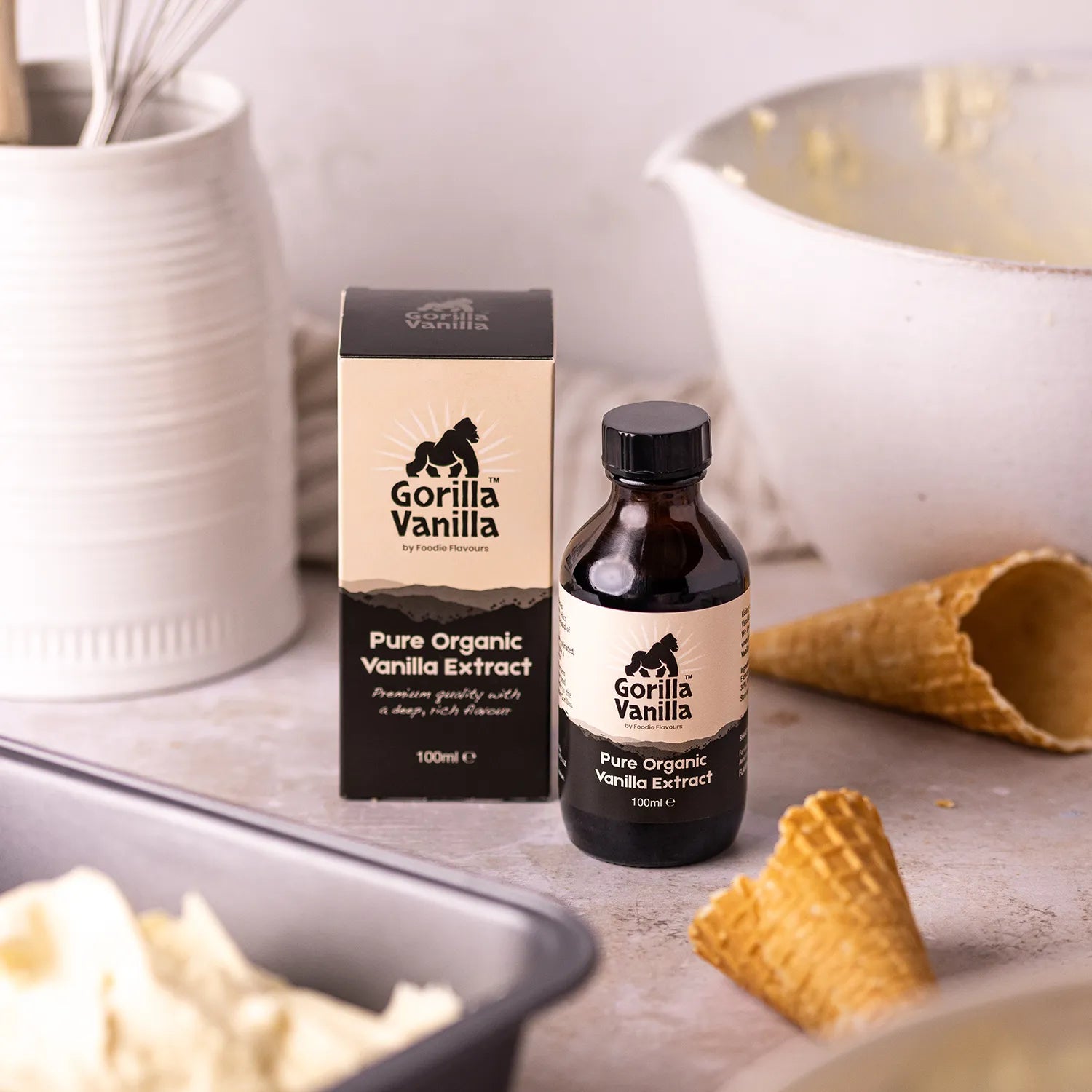 Glass bottle of gorilla vanilla, organic vanilla extract being used in an ice cream recipe