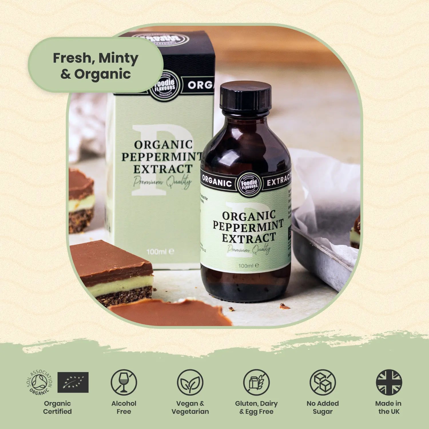Organic peppermint extract bottle and packaging with a dessert in the background