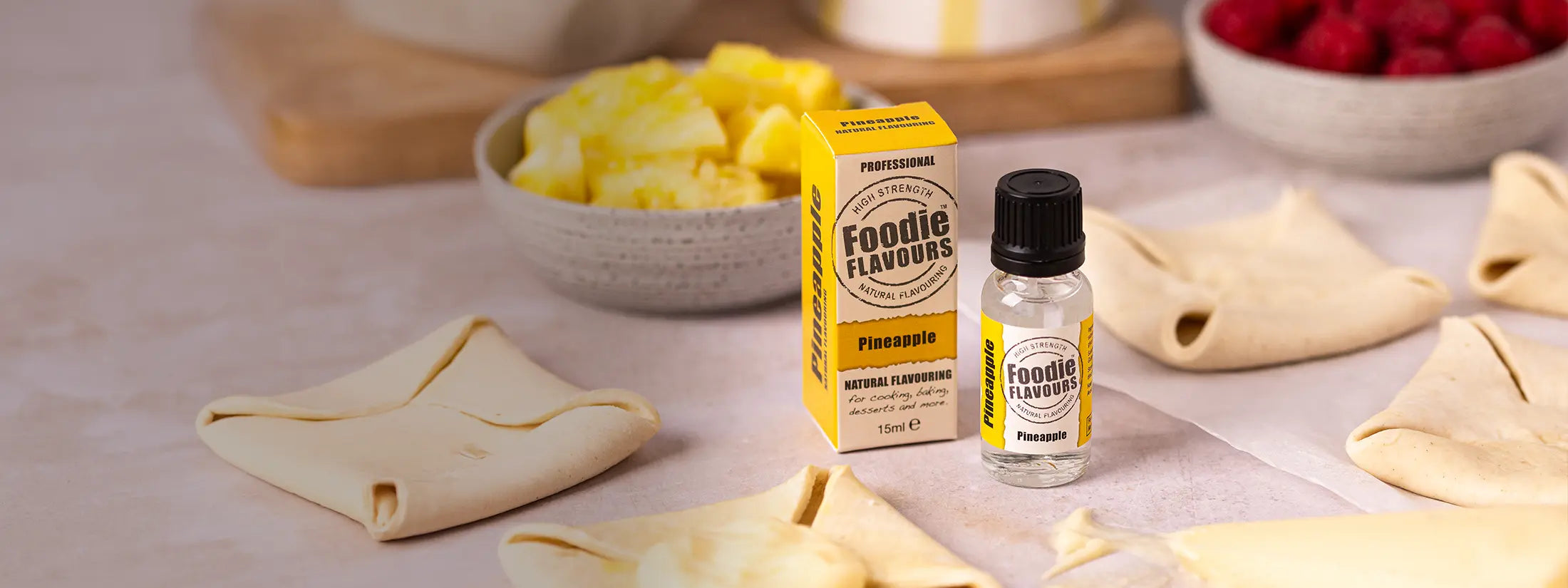 Foodie Flavours pineapple essence on a table with pastry and fruit
