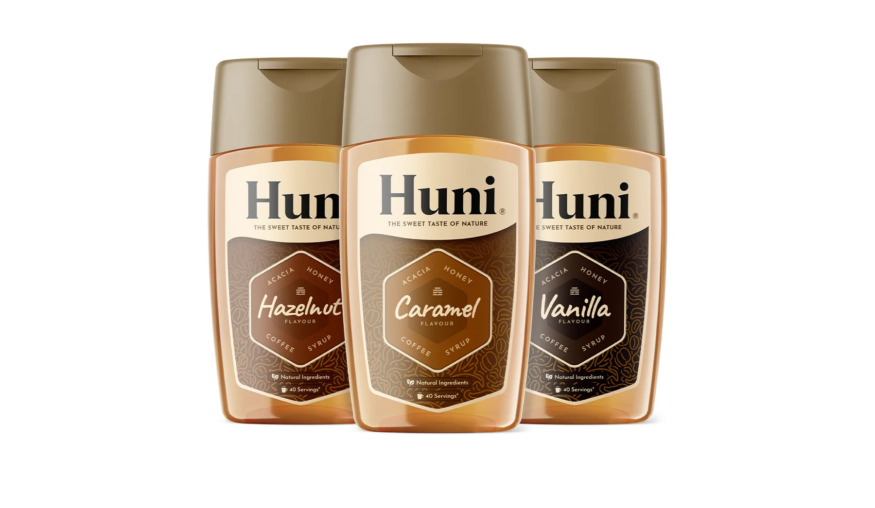 Three bottles of Huni Natural coffee syrup. Caramel, Vanilla and Hazelnut flavours.