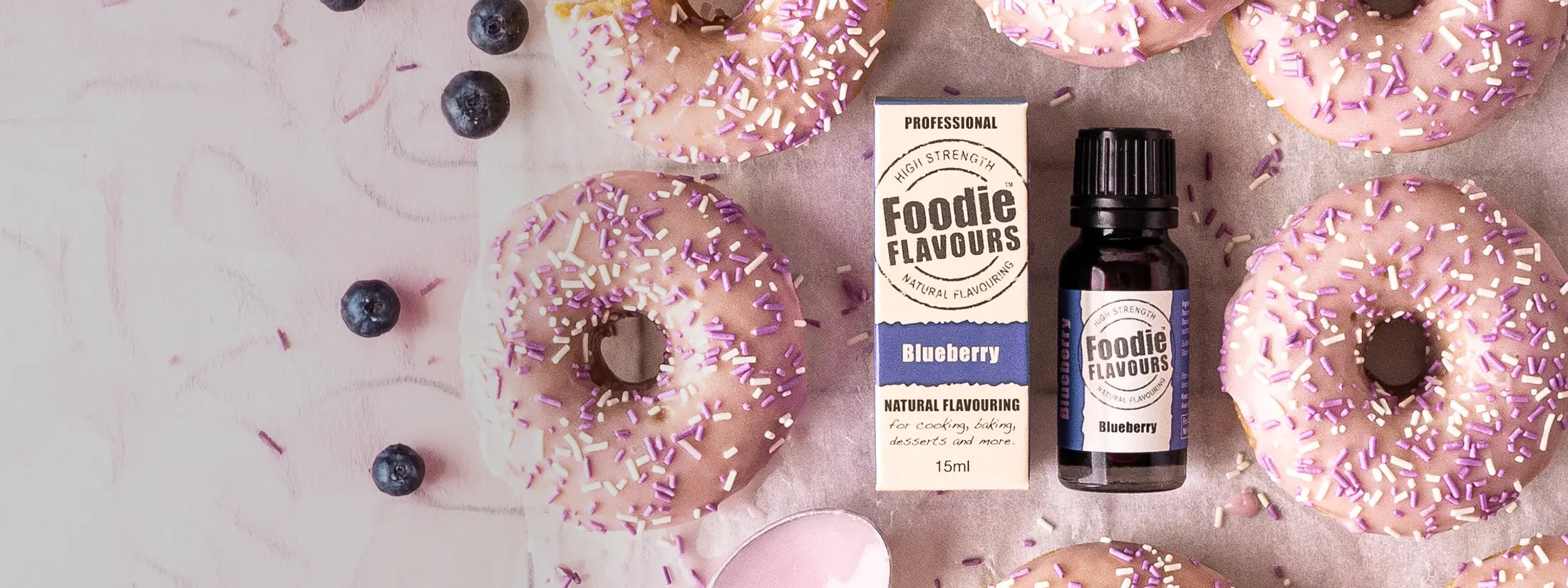 Foodie Flavours Natural Blueberry Flavouring Bottle and blueberry flavoured glazed doughnuts