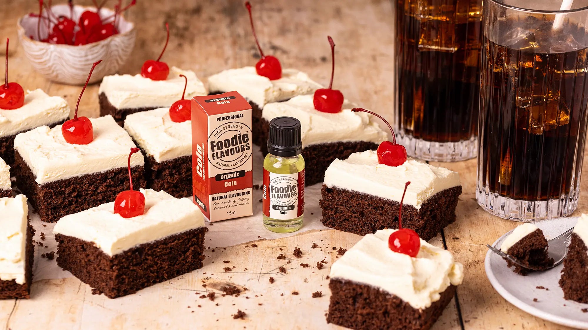 cola float chocolate traybake, glasses of cola, bottle of foodie flavours organic cola food essence.
