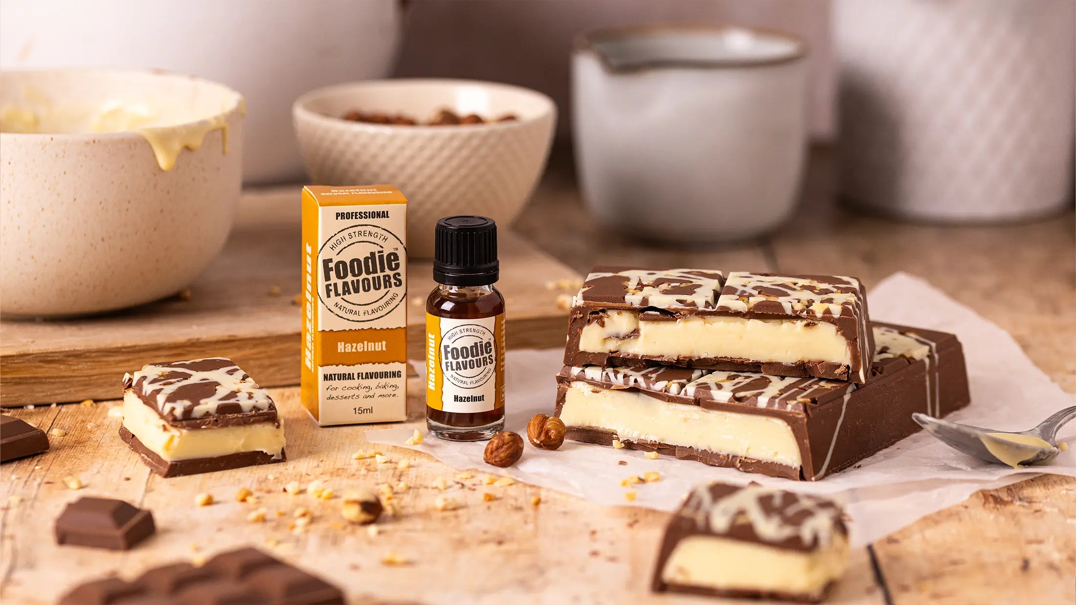 Bottle of Foodie Flavours hazelnut flavouring with hazelnut flavoured ganache filled chocolate bar