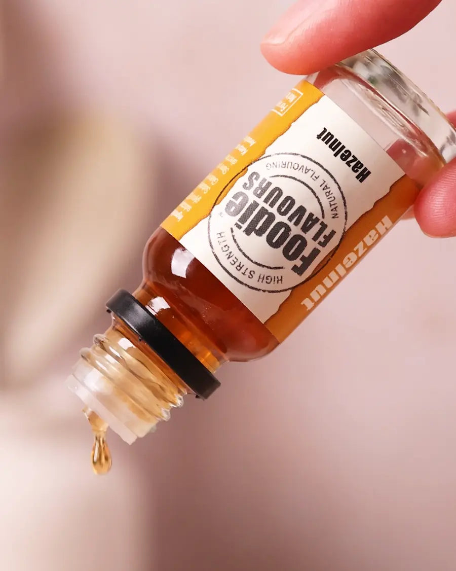 Bottle of Foodie Flavours hazelnut essence with dropper on a blurred background
