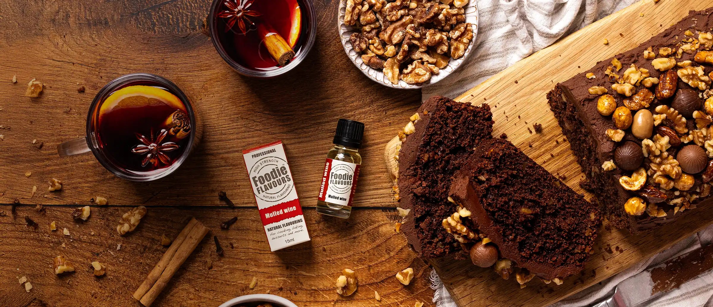 Mulled wine flavoured chocolate loaf cake, festive scene, bottle of foodie flavours mulled wine flavouring