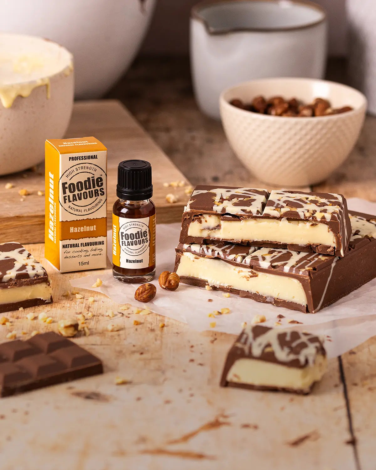 Bottle of Foodie Flavours hazelnut flavouring with hazelnut flavoured ganache filled chocolate bar