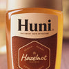 Video of huni natural coffee syrup being added to coffee. Three flavours are featured: Caramel, Hazelnut and Vanilla
